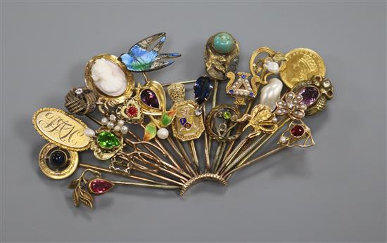 An early 20th century mixed metal including gold and gem set fan shaped brooch, modelled from assorted stick pins, 97mm.